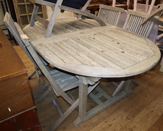 A Lindsey weathered teak garden table and six chairs W.180cm